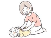 ベビーマッサージをしている母親と赤ちゃんのイラスト